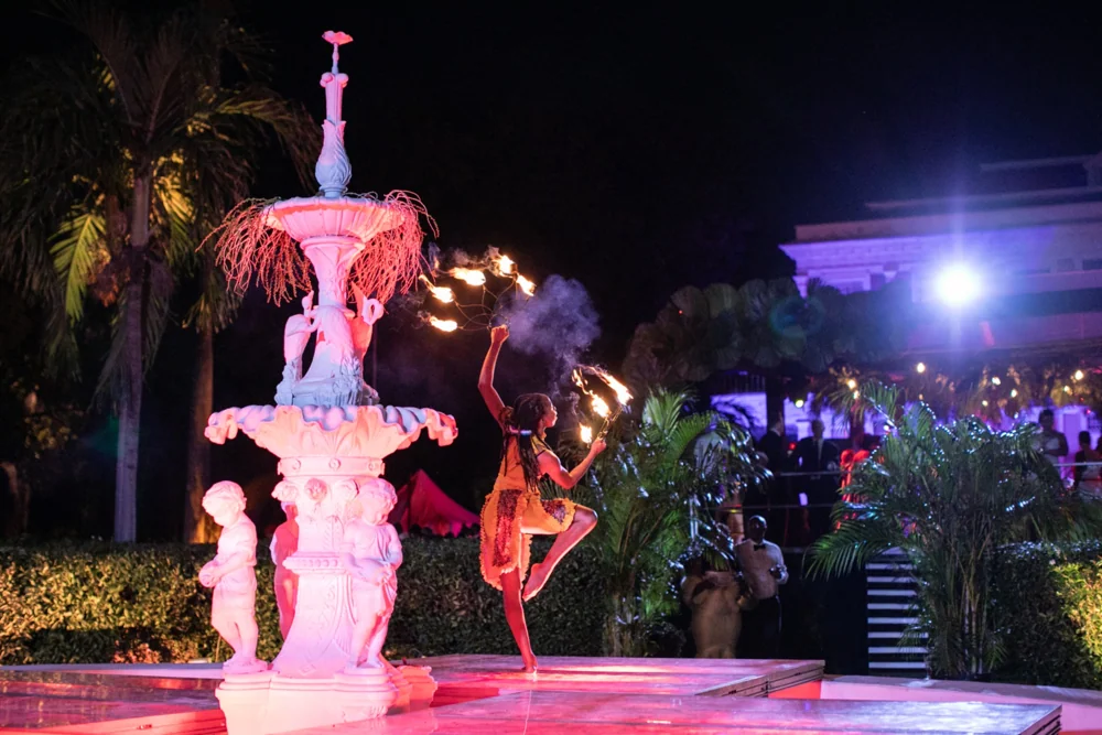The gala fountain with performers and evening lighting